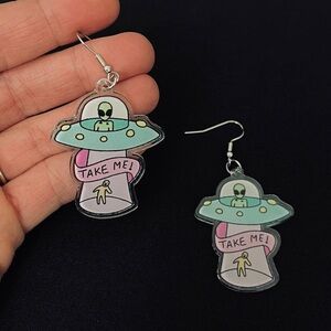 UFO with Alien Inside Beaming up a Human with a “Take Me!” Banner Earrings
